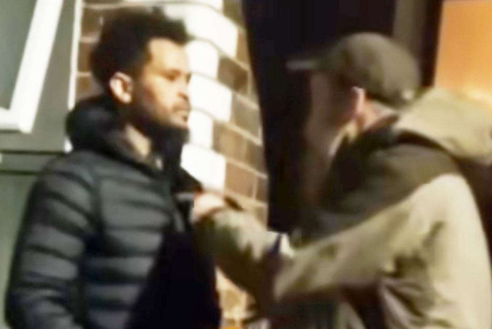 Neil Pinkerton seen confronting a migrant man